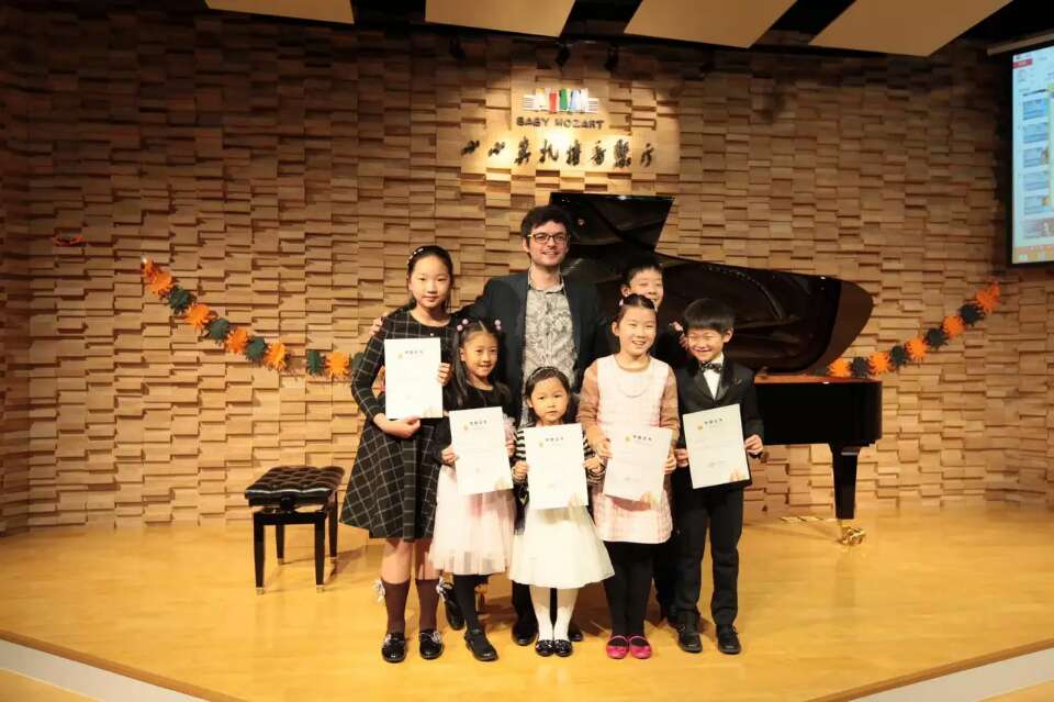 Marko Pavlović with piano students competition award winners in student recital