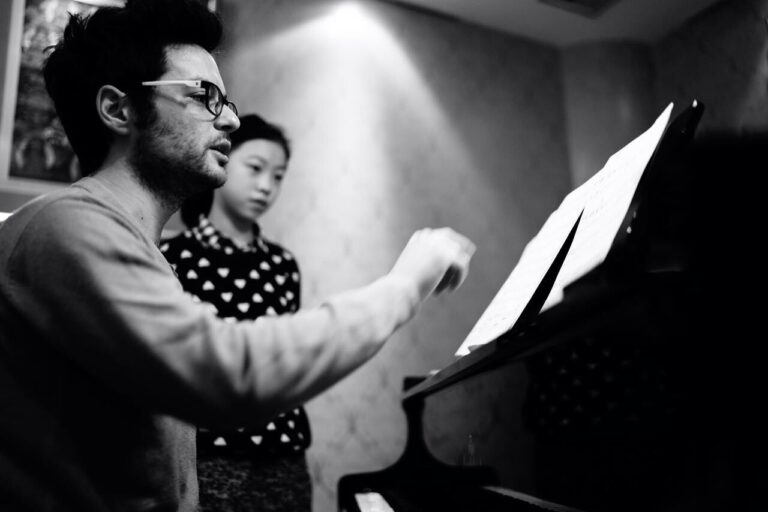 Pianist Marko Pavlović with a student teaching a piano lesson